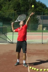 tennis serve throwing ball